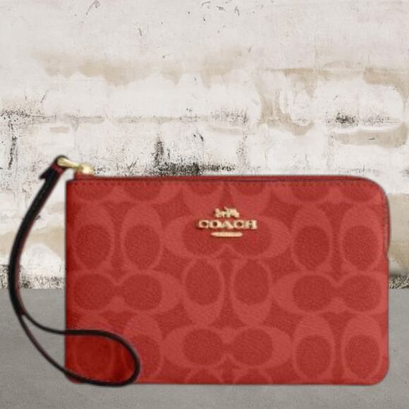 Coach Handbags - Coach Corner Zip Wristlet In Signature Canvas NWT